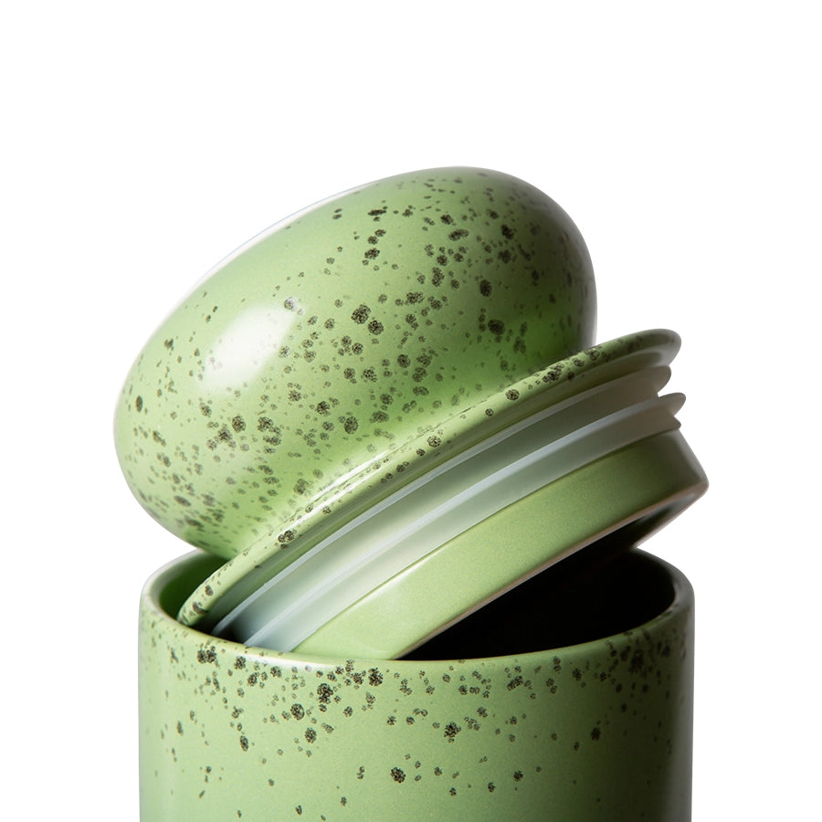 detail of kiwi green stoneware storage jar with lid