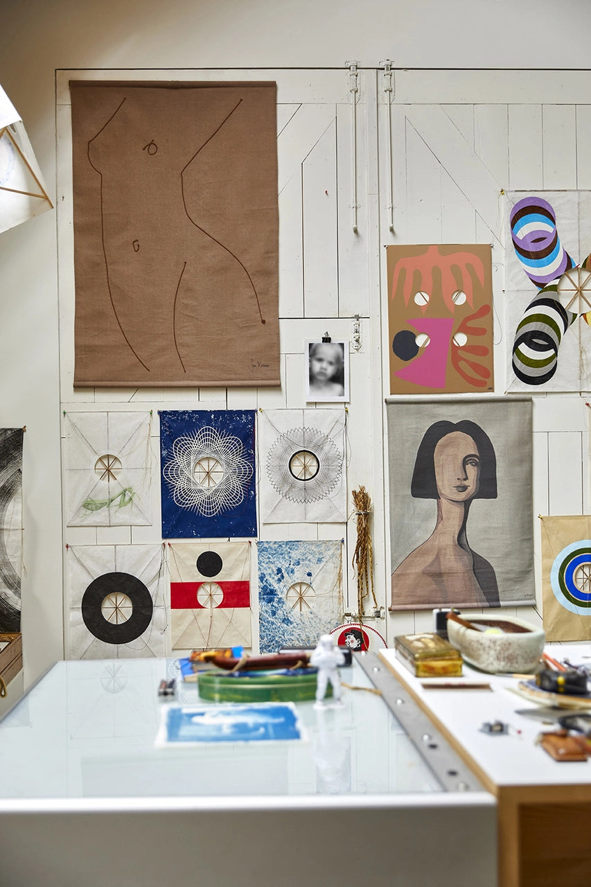 studio view of Sella Molenaar with art works and wall tapestries