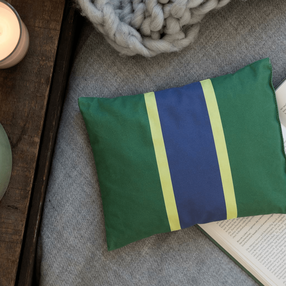 green blue and yellow accent pillow filled with herbs