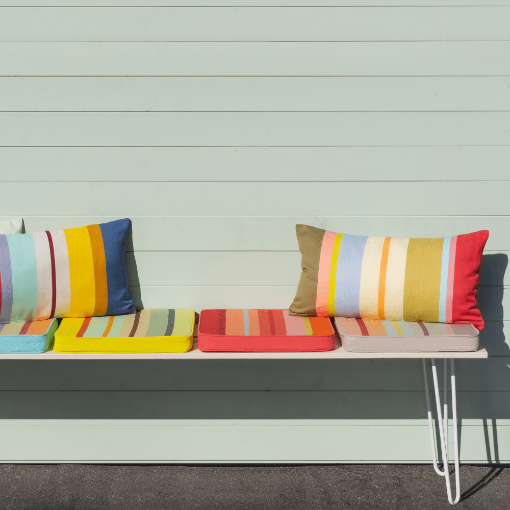 square striped seating cushion on balcony bench