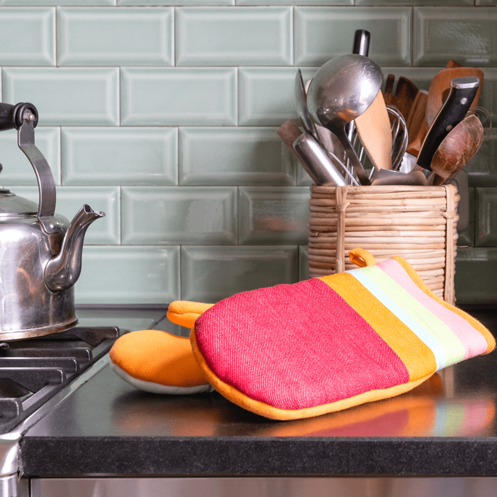 striped oven mitts with orange backing