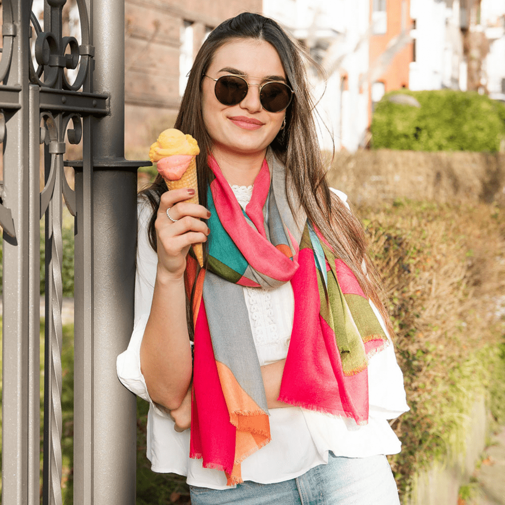 colorful extra long soft scarf worn on a white shirt woman holding ice cream
