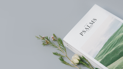 bible book Psalms with flowers on grey table top