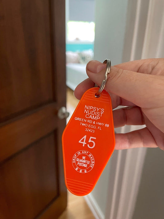 orange motel key FOB with Nipsy's Nudist Camp address