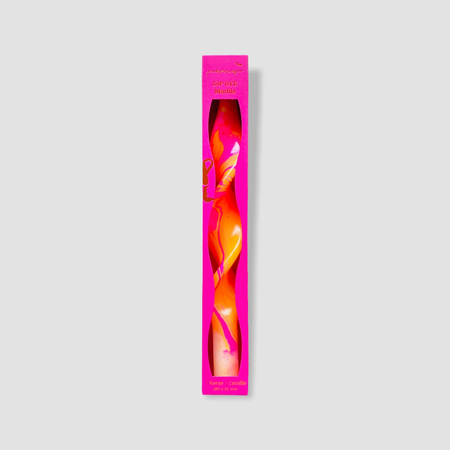 twisted candle with a marble effect in orange and pink  in a pink box