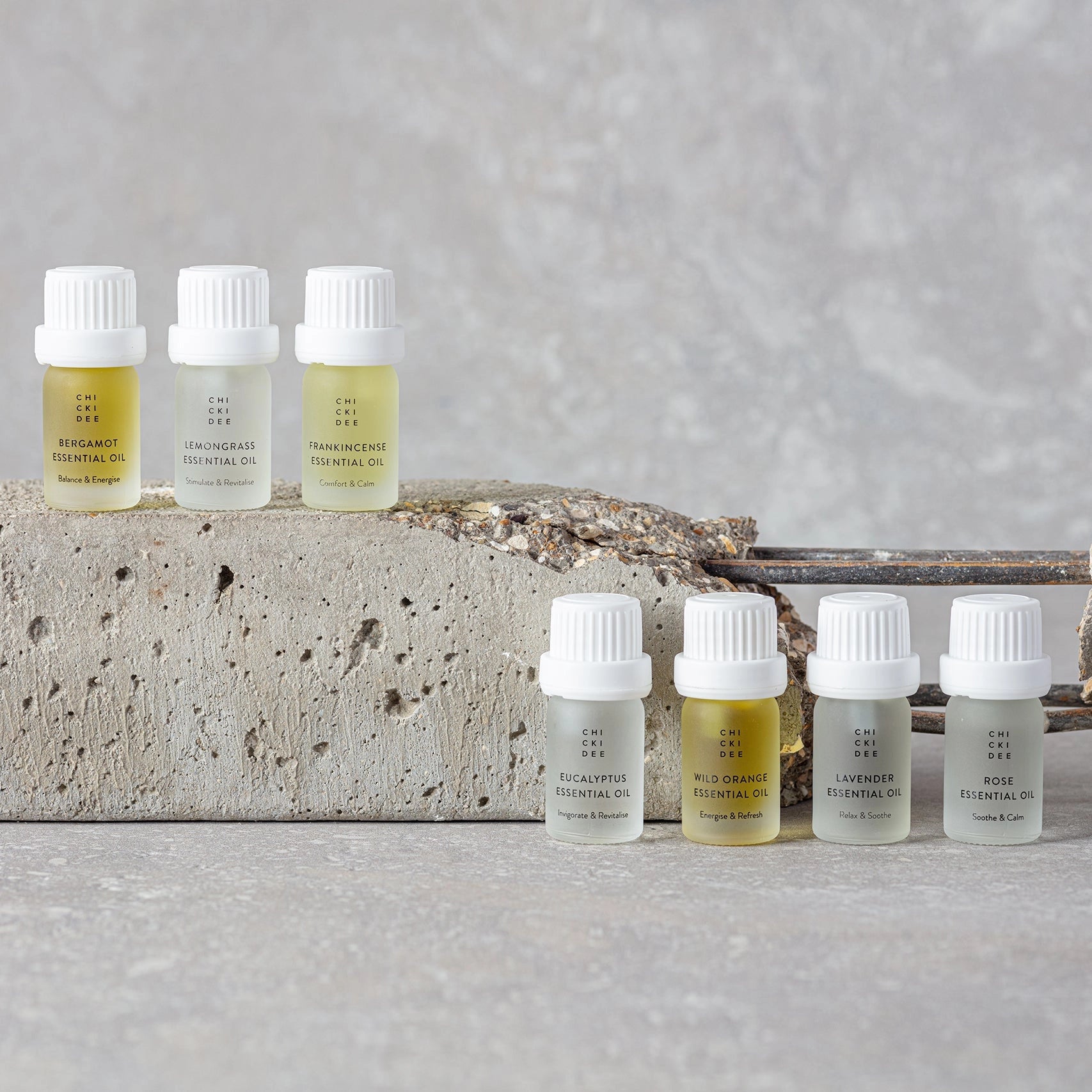 7 bottles filled with essential oils in different compositions