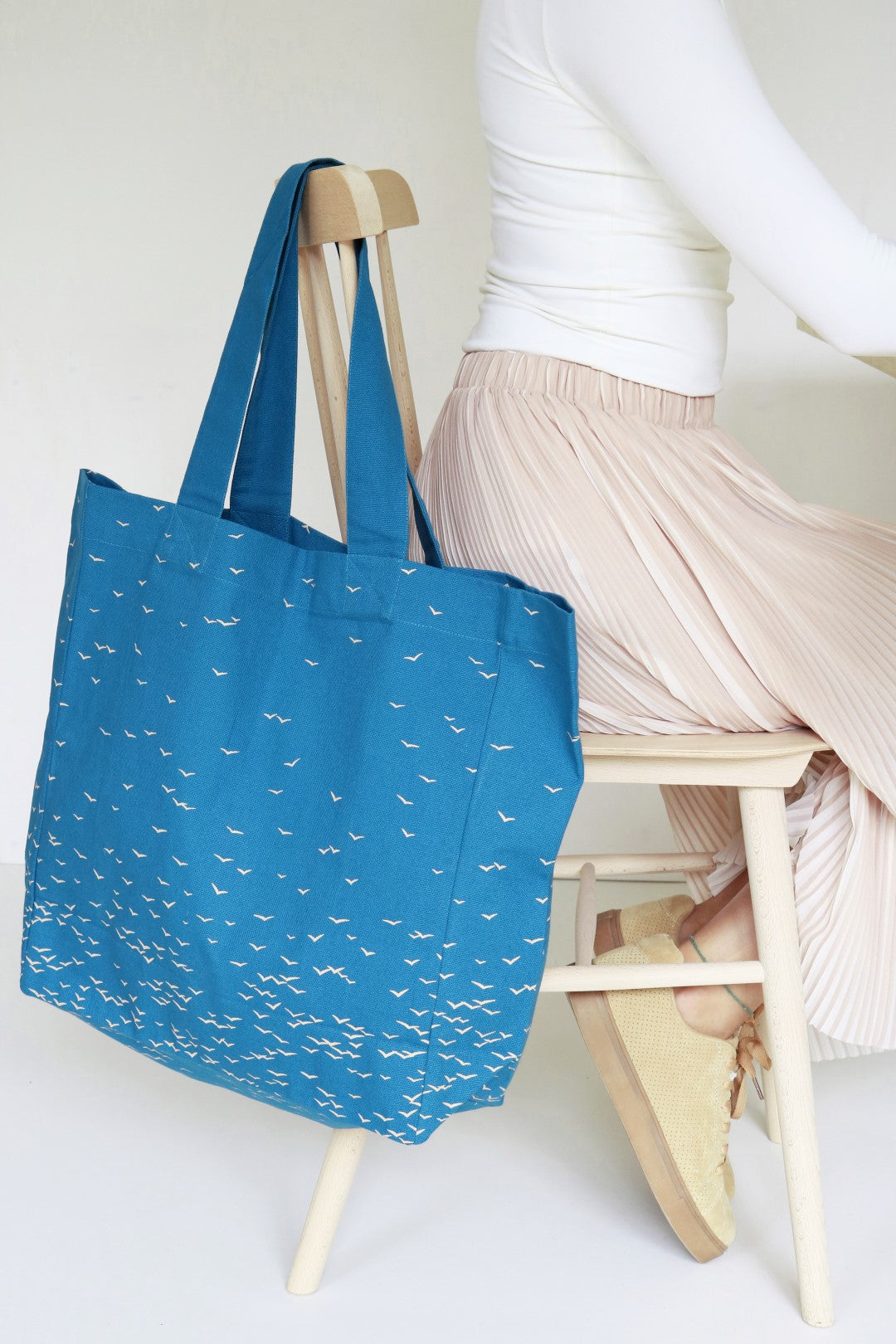 jurianne matter eco friendly blue cotton tote hanging on chair