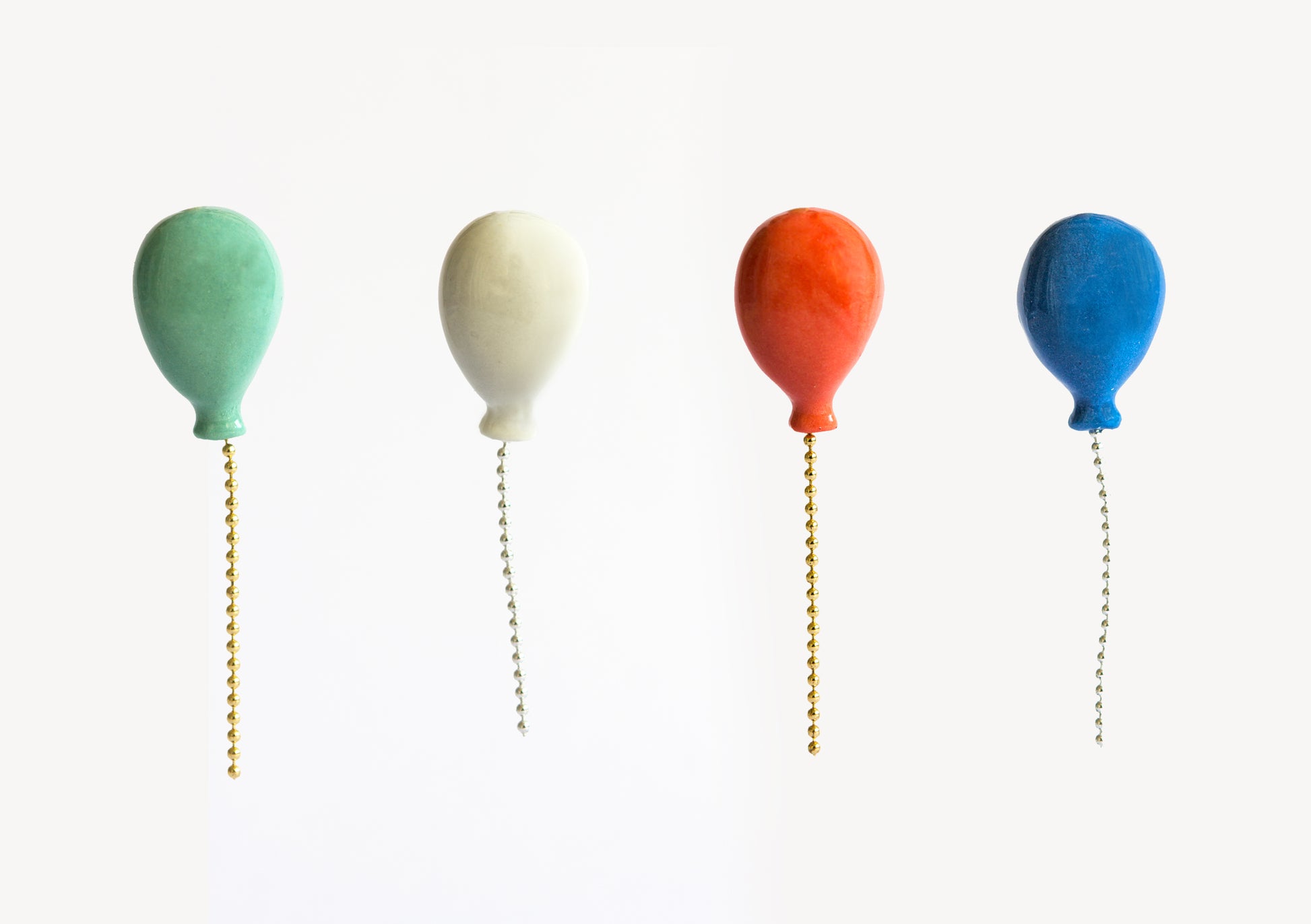 green white red and blue porcelain balloon pins 