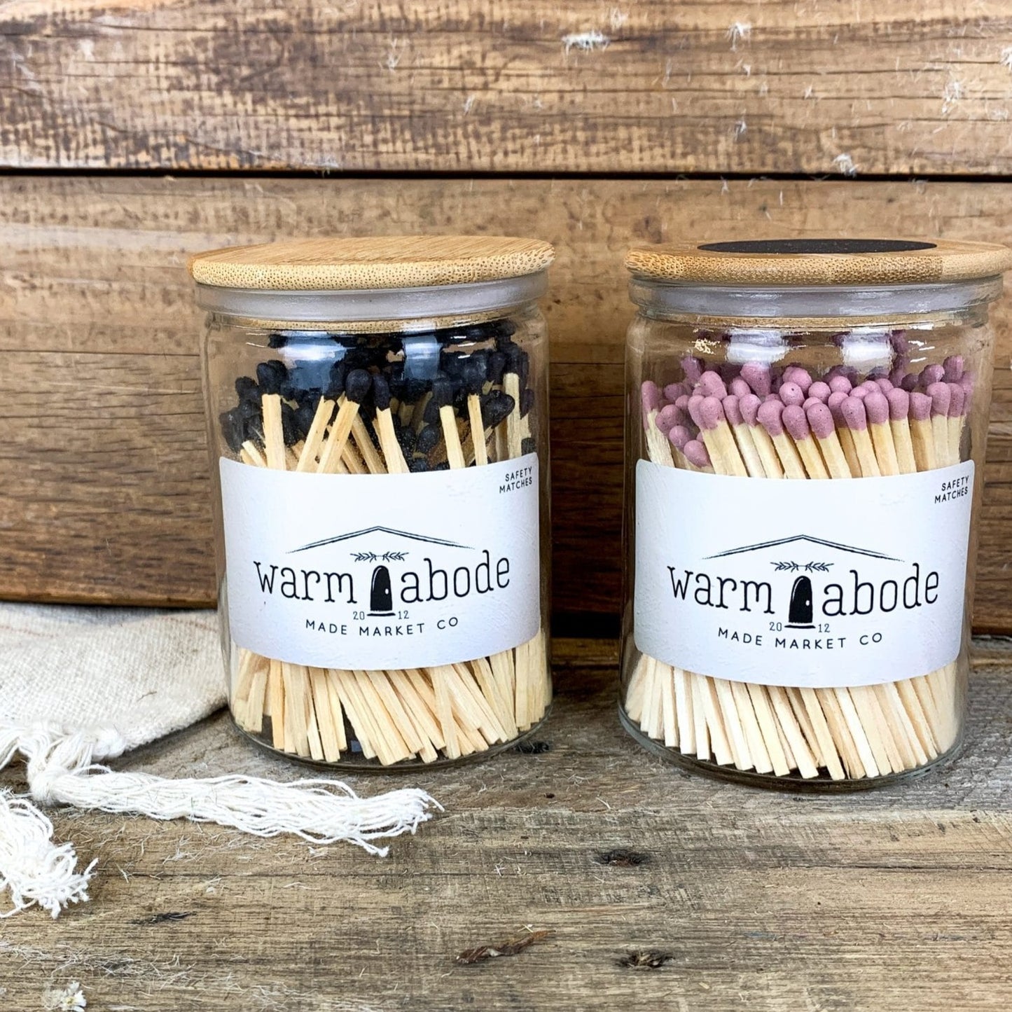 safety matches with black and pink tops in glass jars with lid