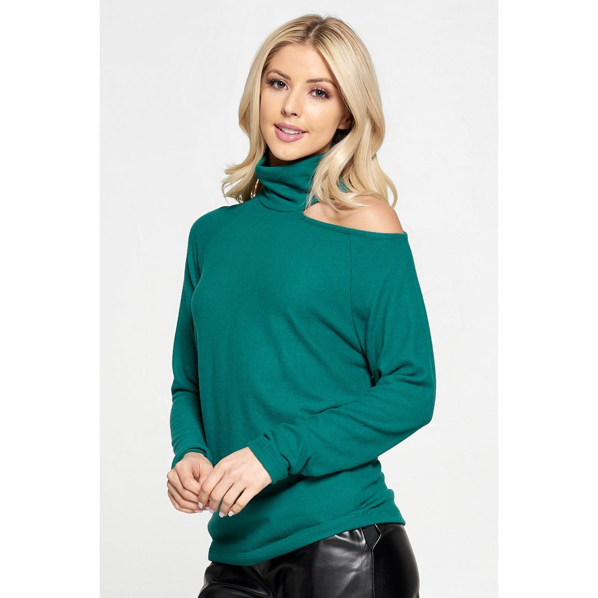 Blonde with green cold shoulder turtleneck sweater