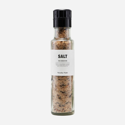 salt with dried mushrooms in a glass grinder bottle with Nordic designed label