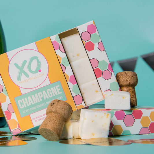 yellow, pink.blue, green and white colored packaging for marshmallows infused with champagne