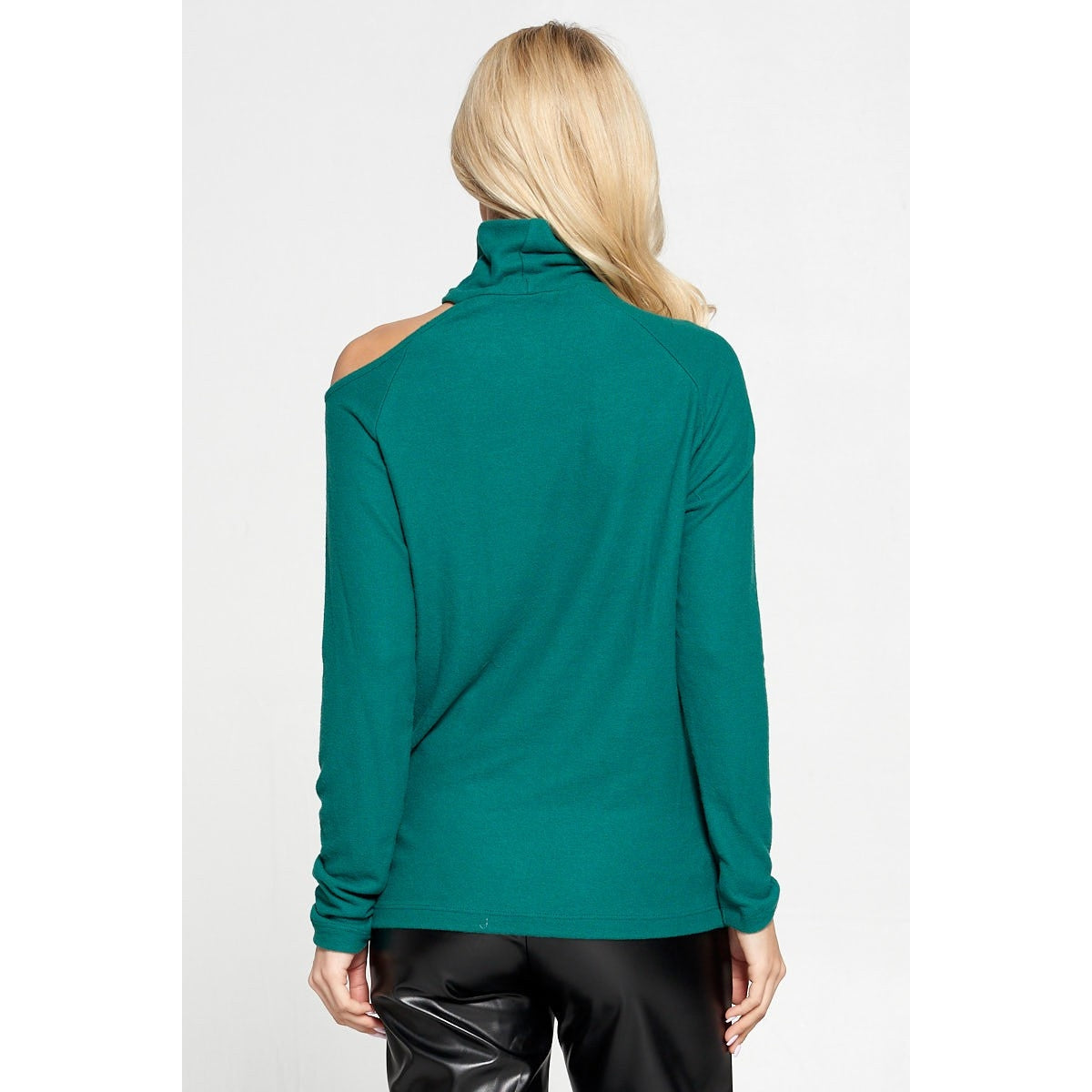 back of a green cold shoulder turtleneck sweater