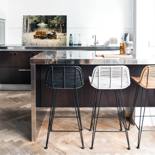open kitchen with natural rattan counter stools in black white and naturel