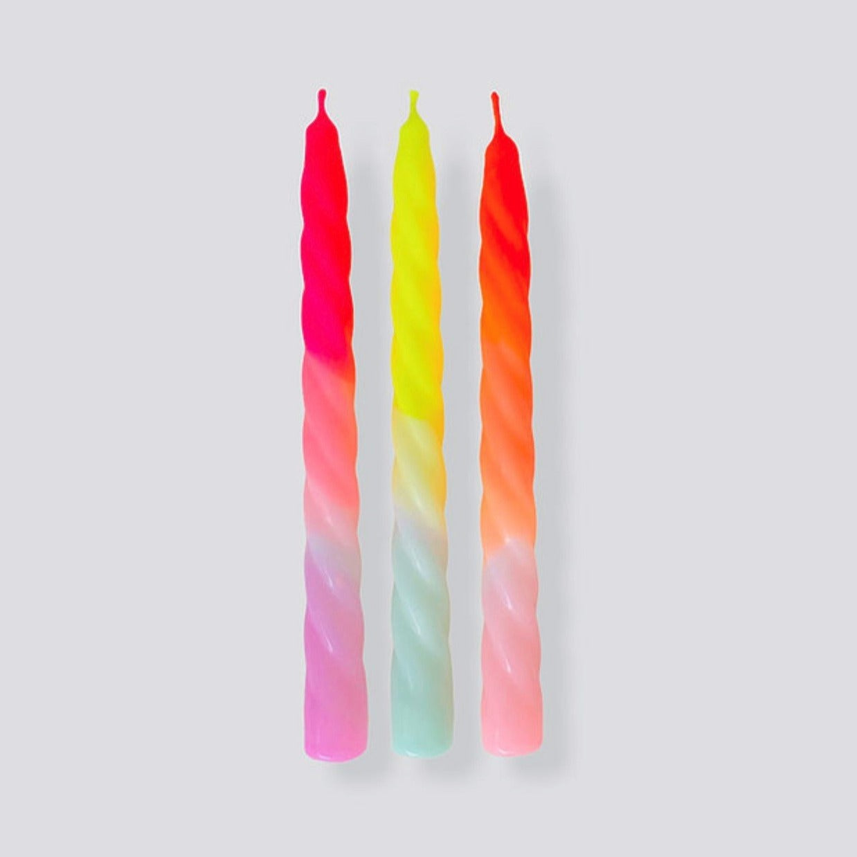 set of three twisted dip dye candles in neon colors