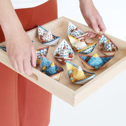 paper boats on a tray