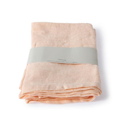 two 100% linen napkins in salmon color folded in paper wrap