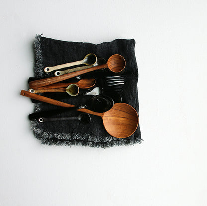 wooden spoons in a linen napkin